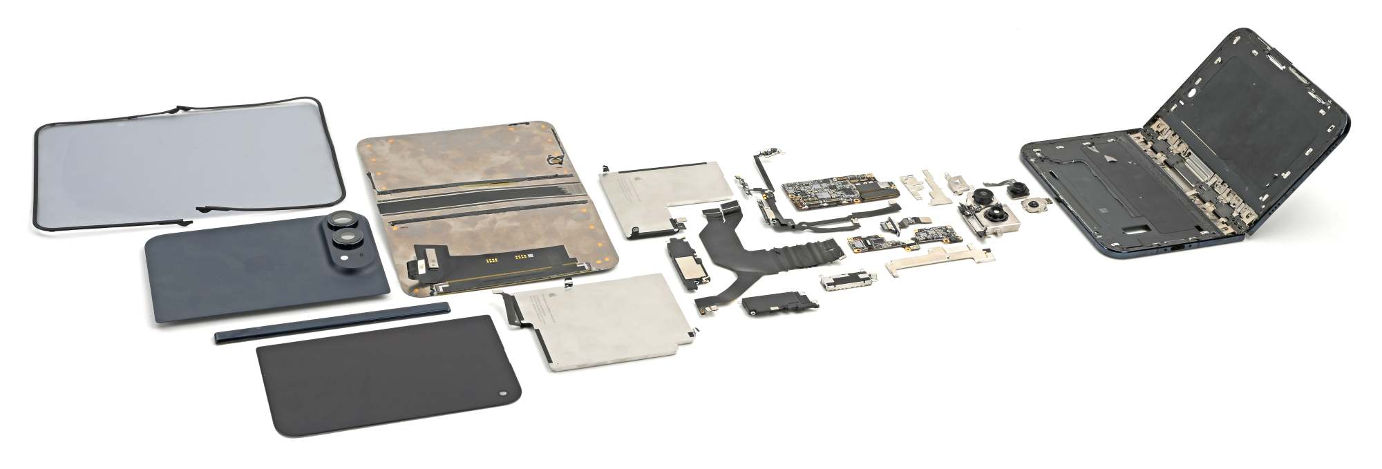 iPhone Duo completamente smontato da iFixit Tutti i componenti interni di iPhone Duo disposti dopo lo smontaggio di iFixit