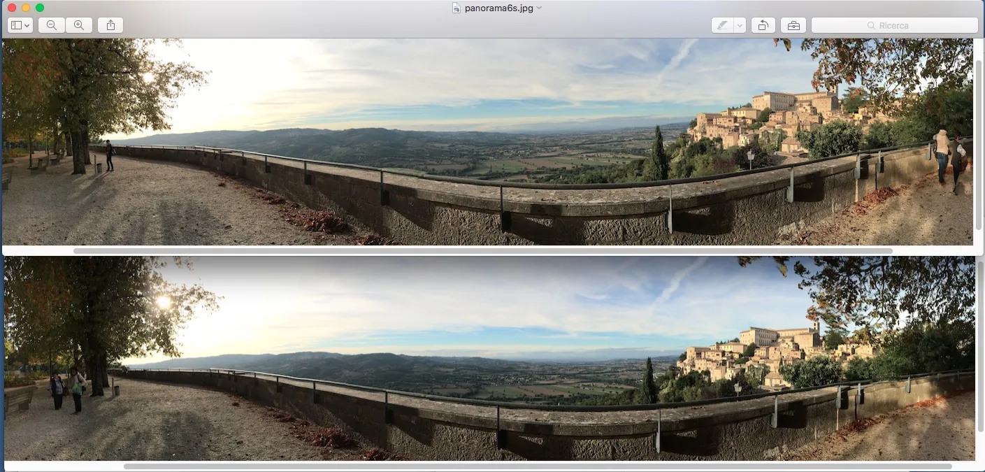 La foto panoramica in alto, realizzata con iPhone 6s ha una gamma tonale più estesa di quella in basso, realizzat con iPhone 5s. Si notino i colori delle nuvole e la città di Todi sulla destra.